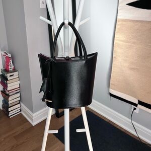 Century 21 black purse with red interior.